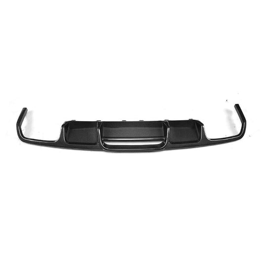 A black automotive rear bumper lip or diffuser insert with integrated reflectors, shown against a plain white background.